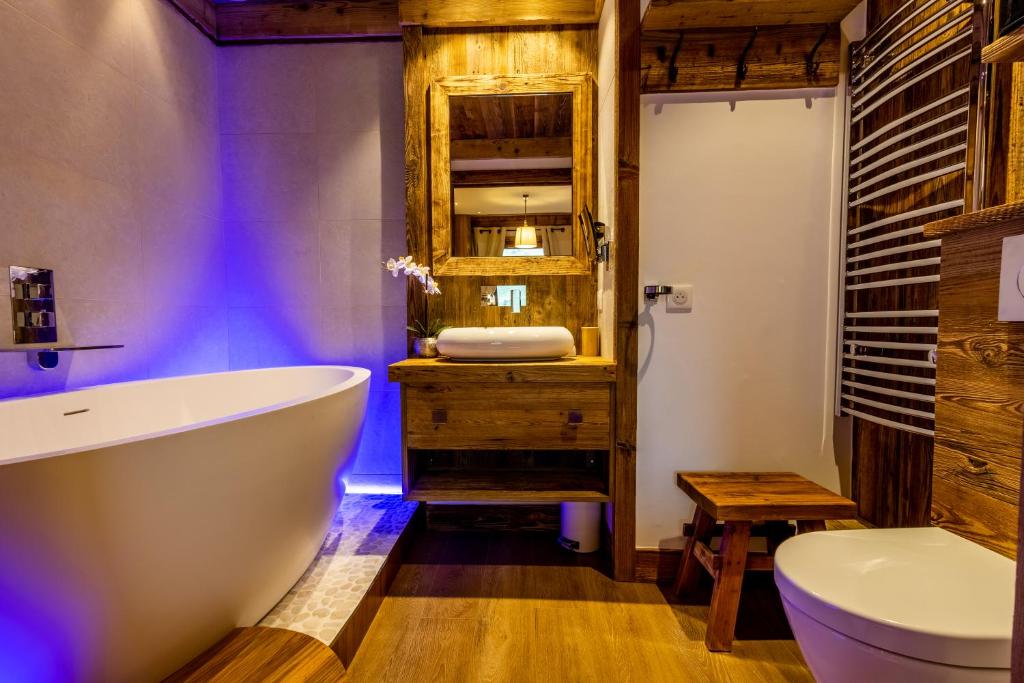 Arc 1950 ambiance chalet luxe 57pers dans residence 5 skis aux pieds avec SPA appartement pied des pistes 10