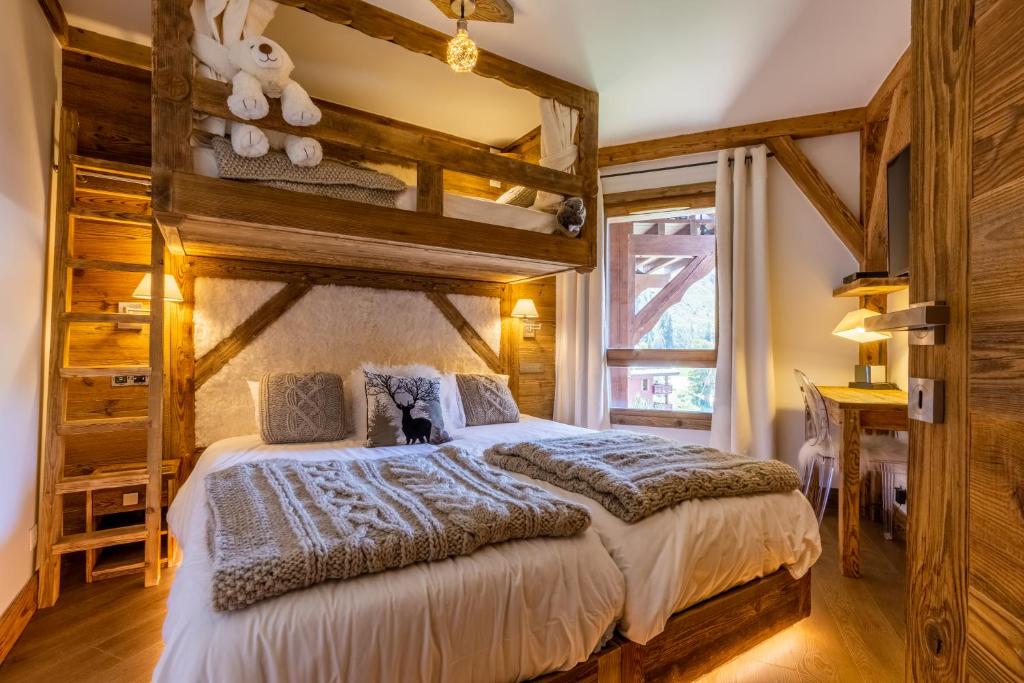 Arc 1950 ambiance chalet luxe 57pers dans residence 5 skis aux pieds avec SPA appartement pied des pistes 5