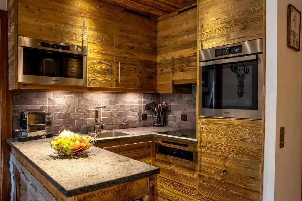 Arc 1950 ambiance chalet luxe 57pers dans residence 5 skis aux pieds avec SPA appartement pied des pistes 9