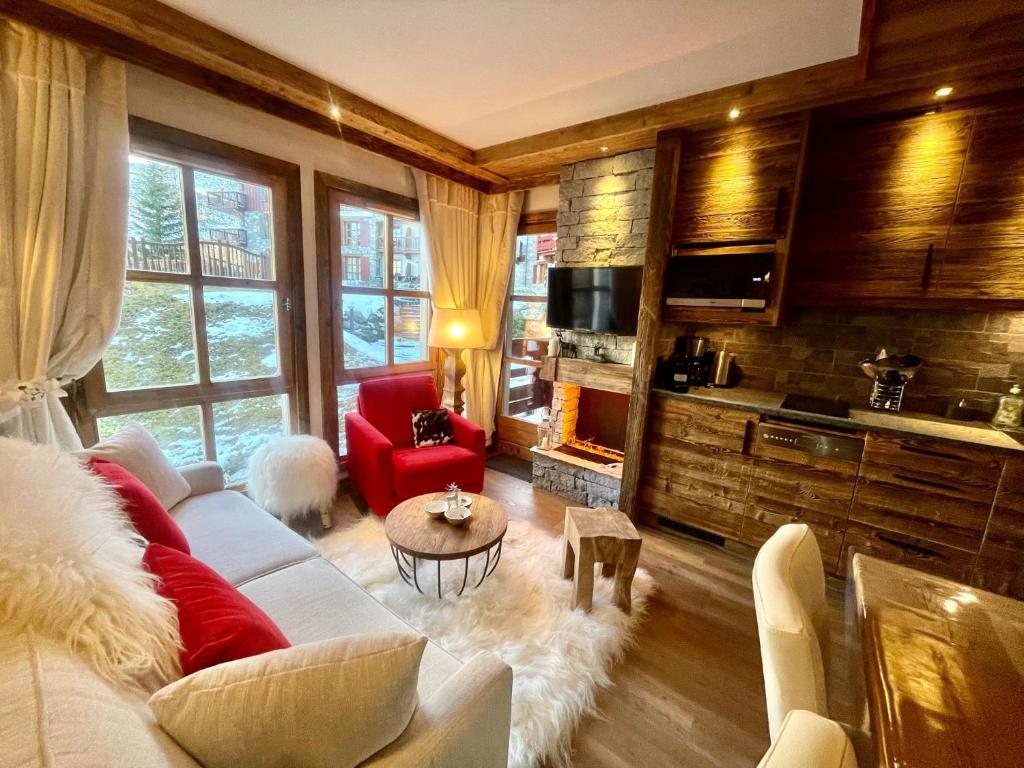 Arc 1950 appt luxe 2 4pers skis aux pieds SPA piscines interieure et exterieure sauna hammam appartement pied des pistes 4