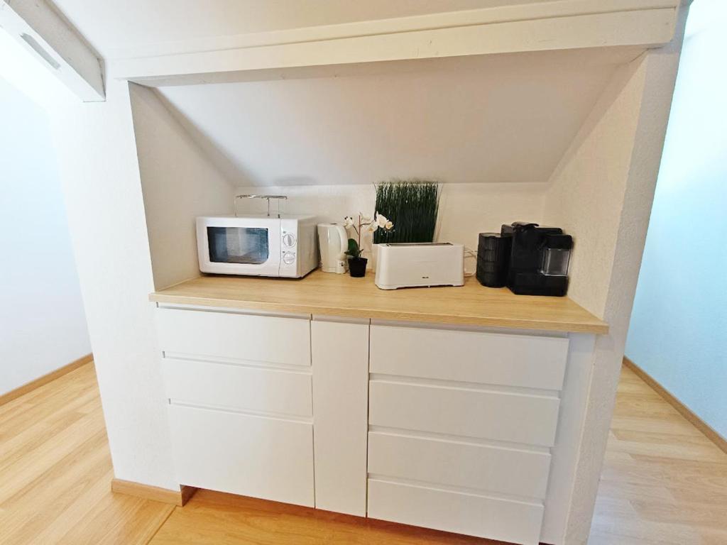 LEsquiros studio centre Luchon casier a skis wifi ascenseur 3 personnes appartement pied des pistes 10